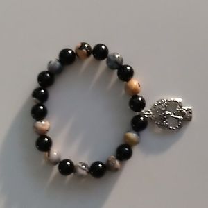 Orange and Black stretch bracelet with skull charm